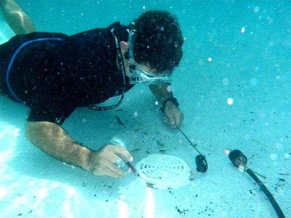 Scuba Diving pool repair tech